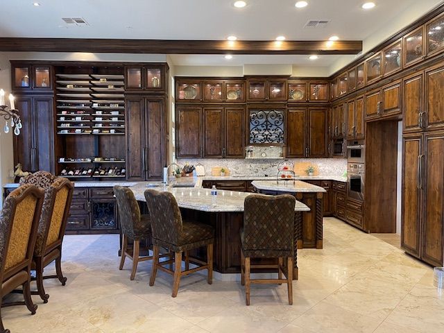 A kitchen with a large island and lots of cabinets