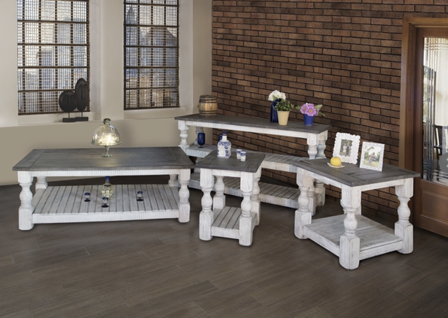 A living room with a brick wall is filled with furniture