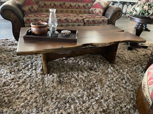 A living room with a couch and a coffee table