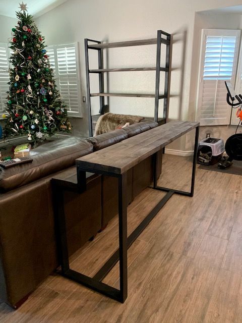 A living room with a couch and a Christmas tree