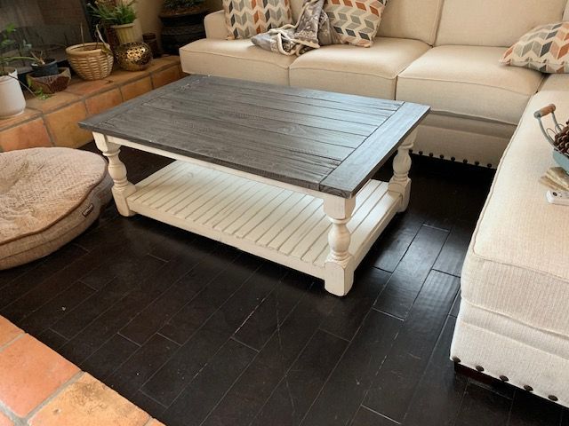 A living room with a couch and a coffee table