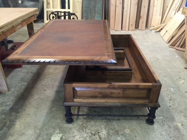 A wooden table with a drawer underneath it