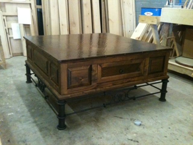 A wooden table is sitting in a room