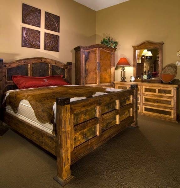 a bedroom with a bed dresser and mirror