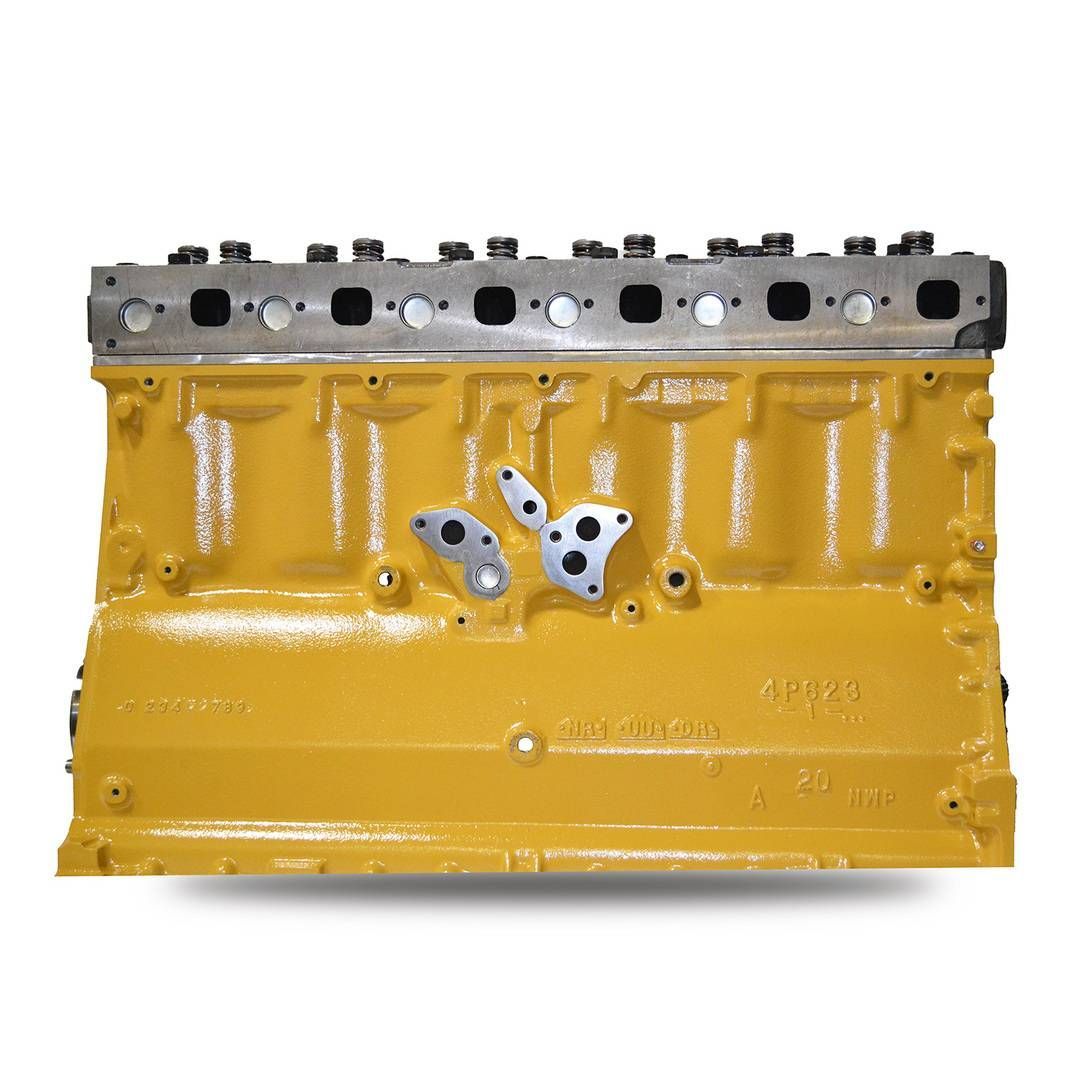 Metal engine cylinder head with multiple valve openings and bolt holes on a light background