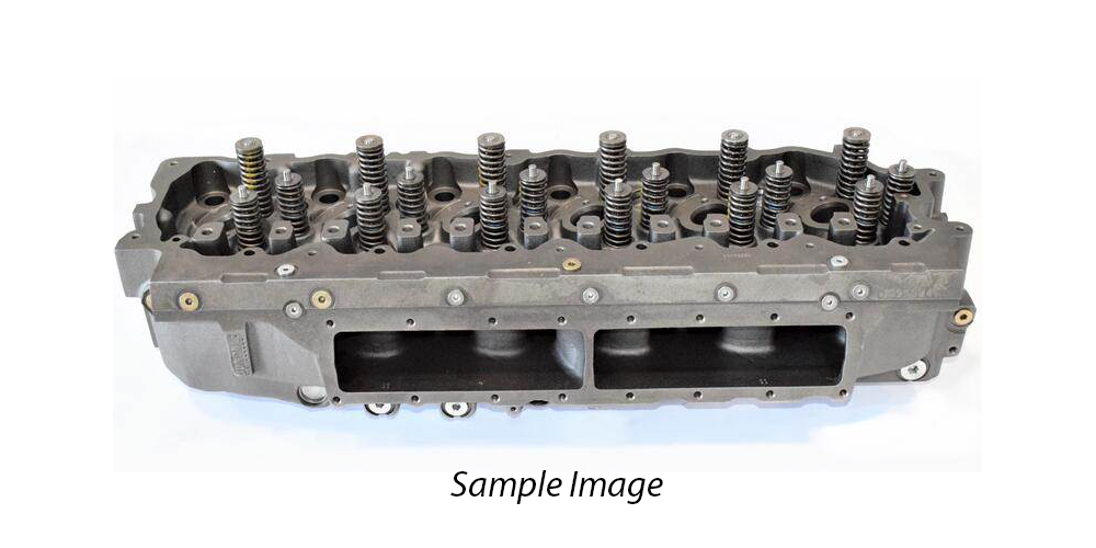 Metal engine cylinder head with multiple valve openings and bolt holes on a light background