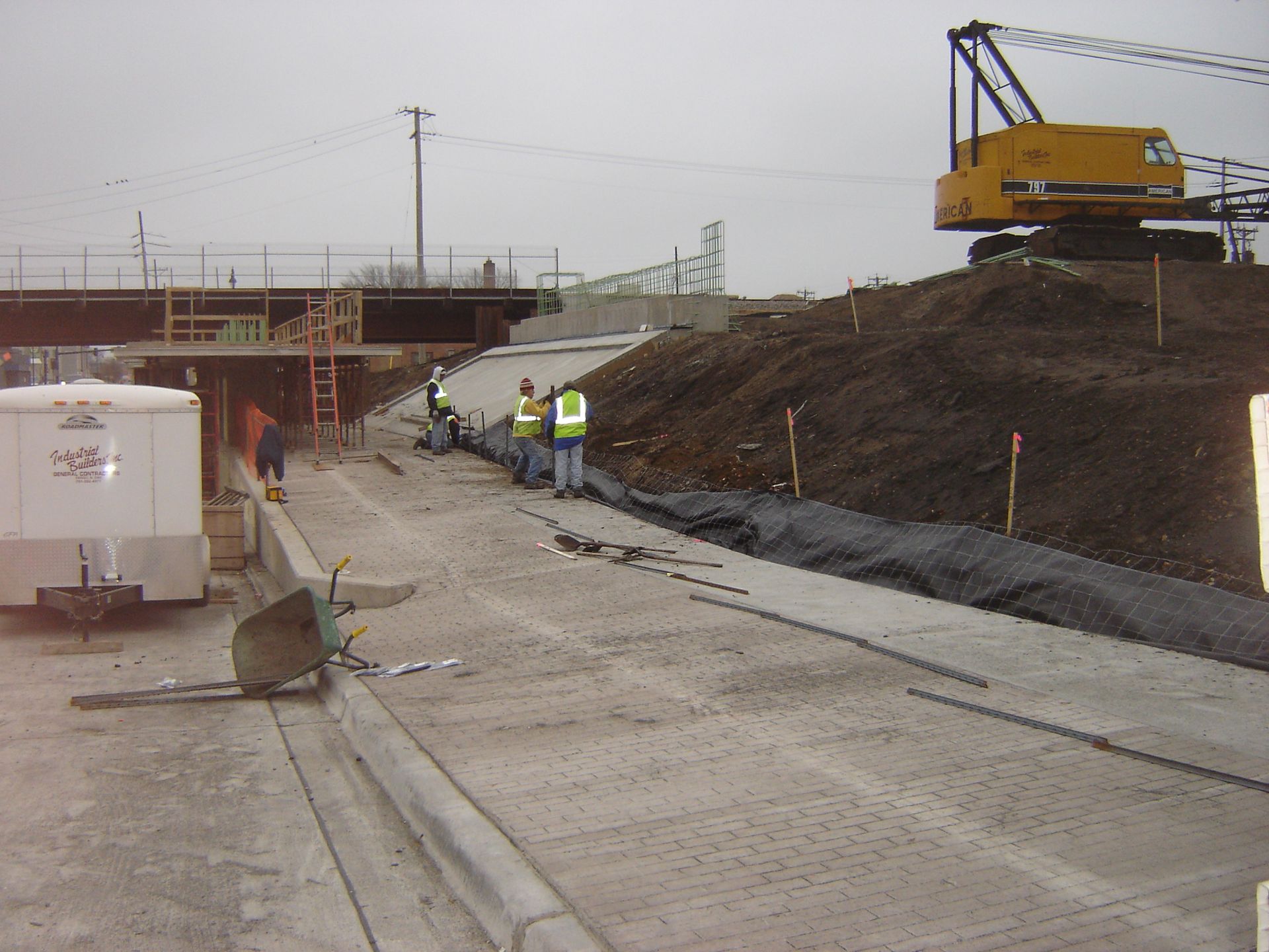 A construction site with a crane in the background