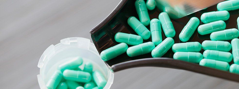 Close-up of capsules in dispensing tray
