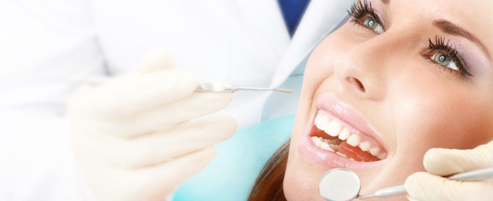 Women smiling while on dental checkup