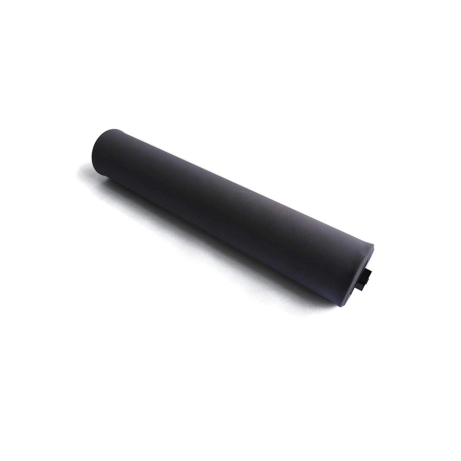 A black cylinder is sitting on a white surface.