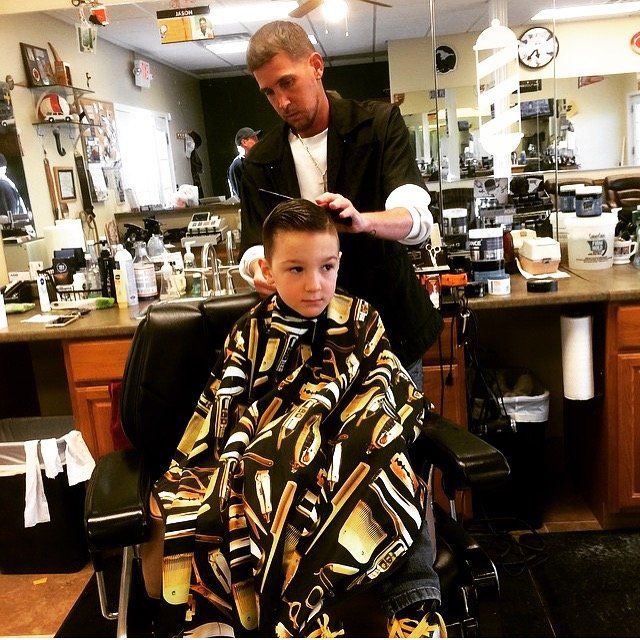 Cute kid having a hair cut