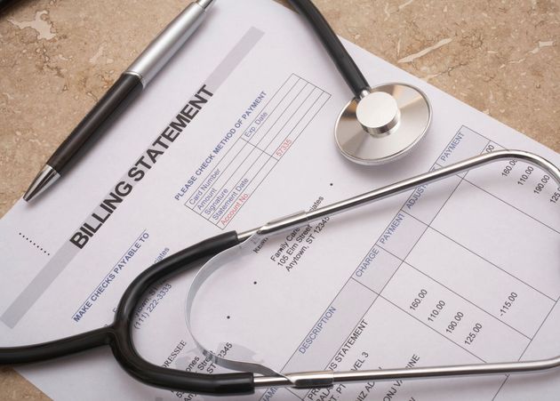 Billing statement with a stethoscope on a desk