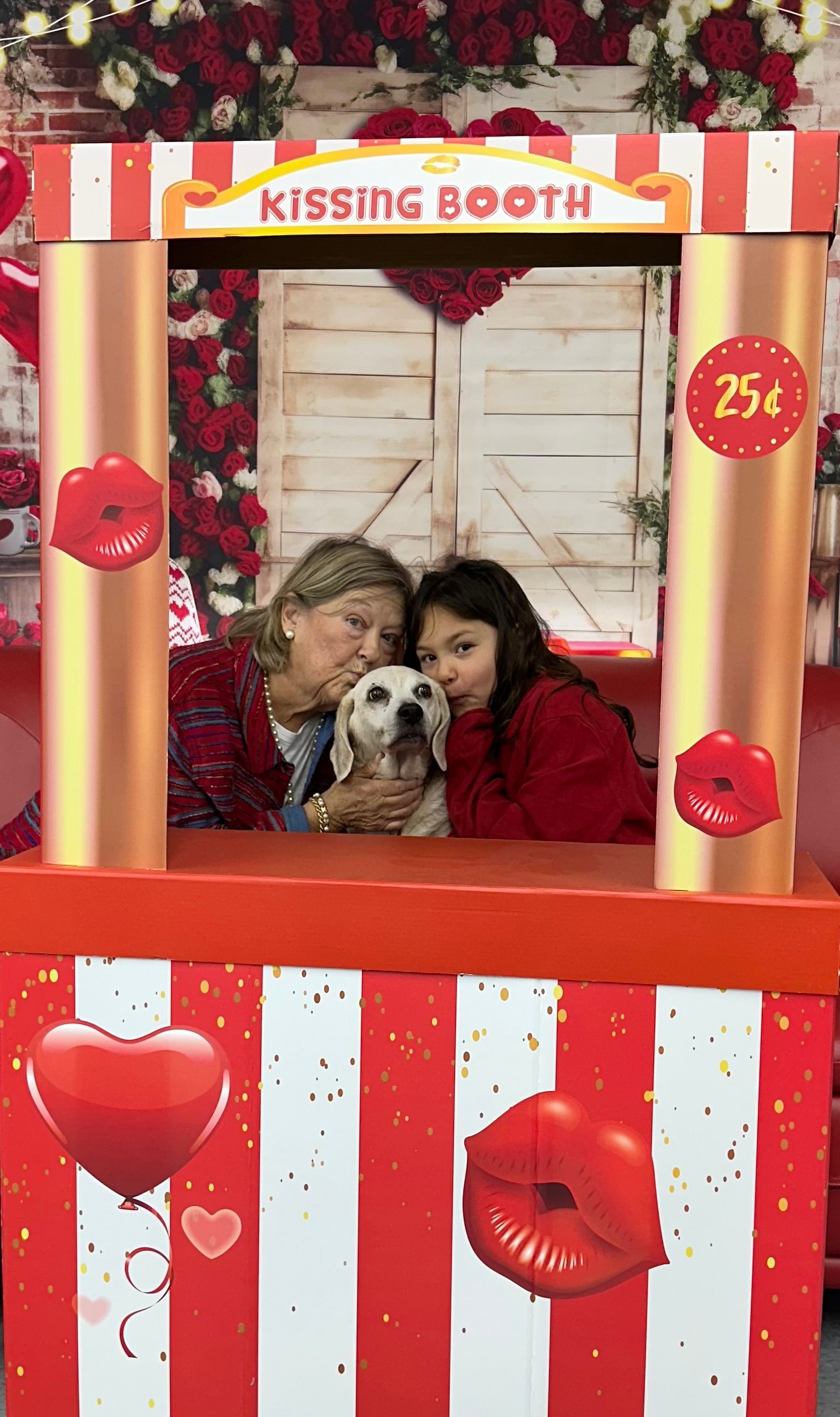 Two people and a dog in a 