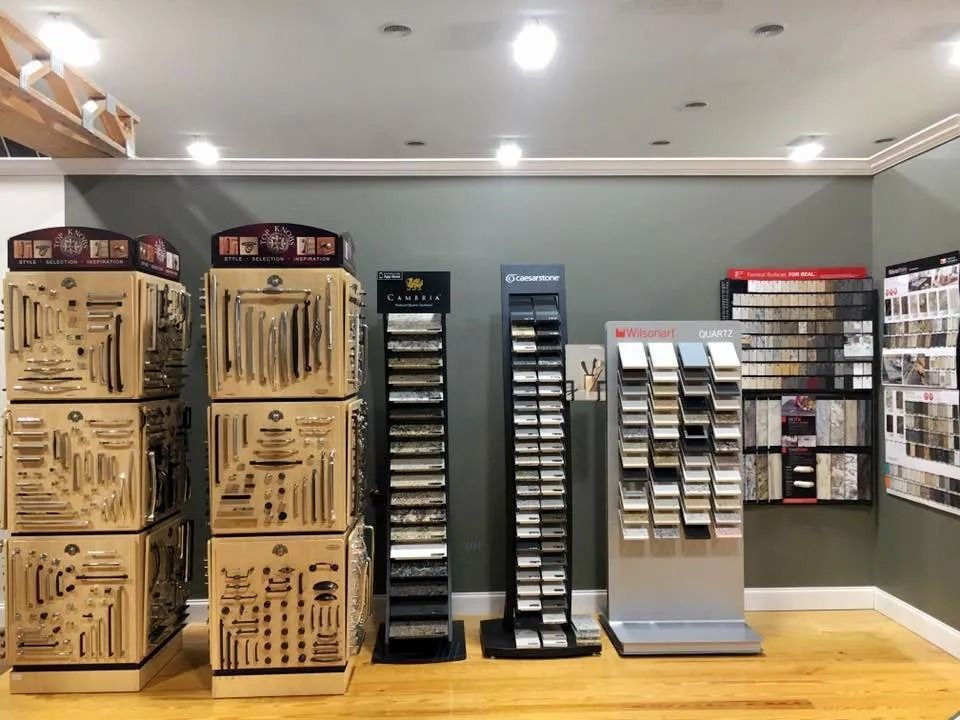 Display of storage bins and sample racks in a gray retail showroom