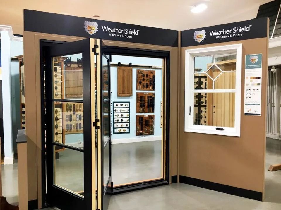 Weather Shield window and door display booth with black and tan panels in a showroom