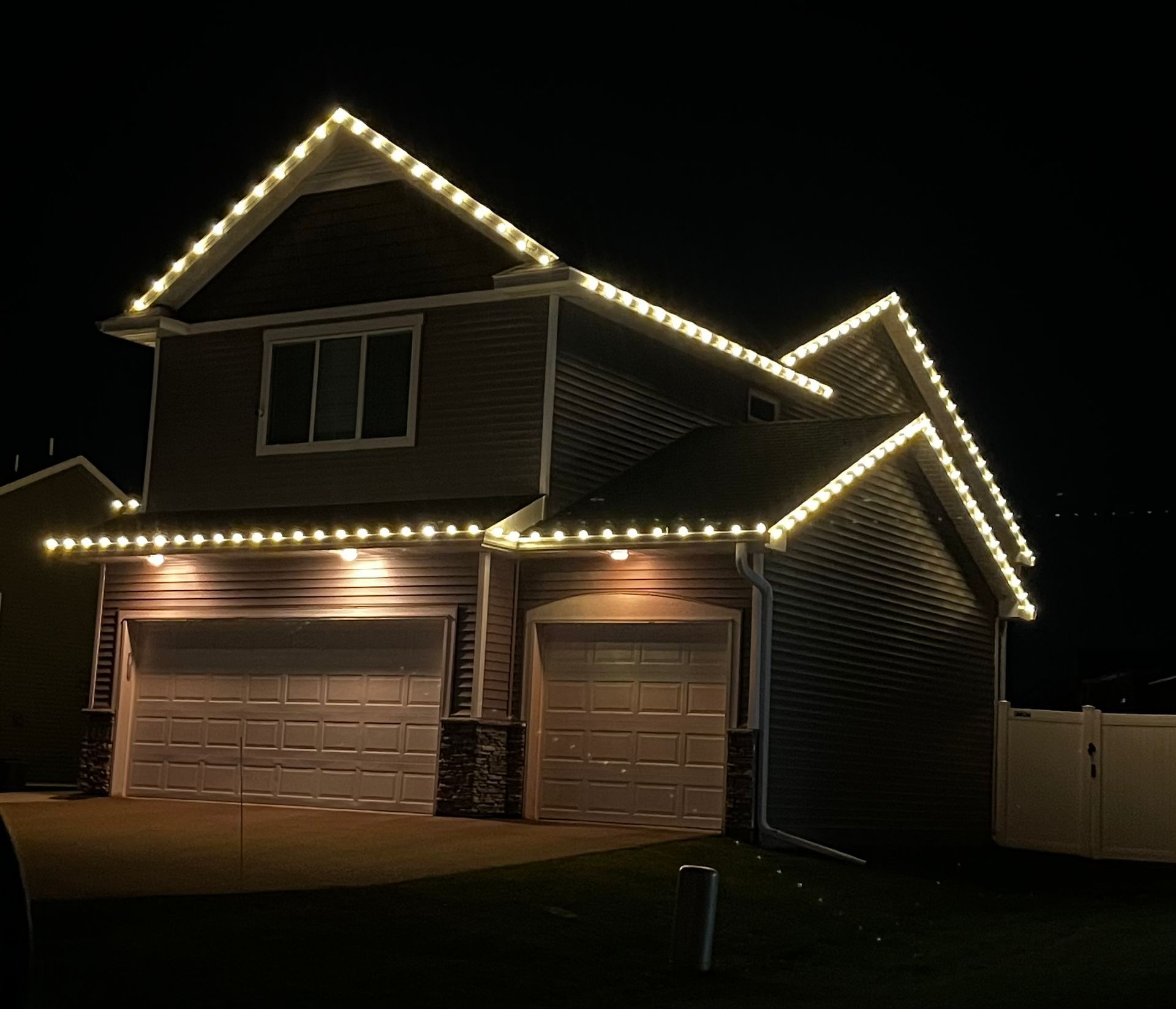 A house is lit up with Christmas lights.