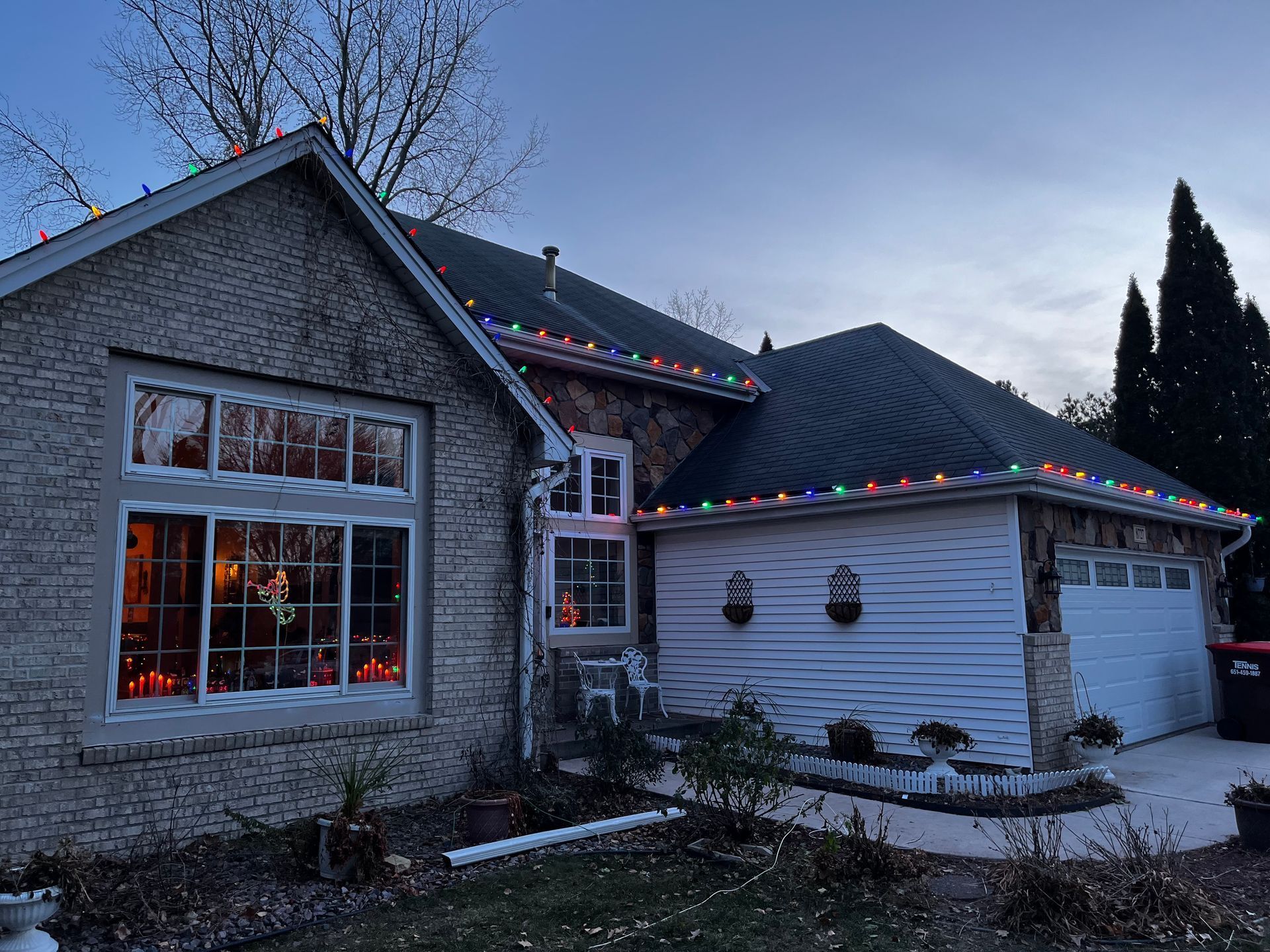 A house with Christmas lights on the side of it.
