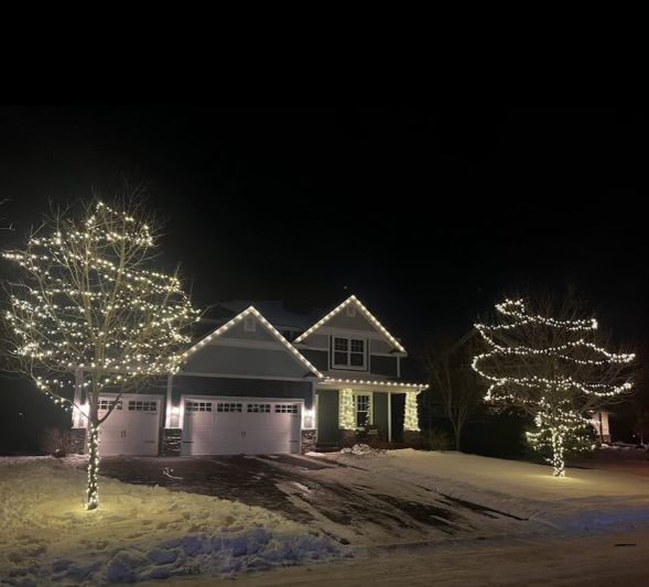 A house is lit up with Christmas lights.