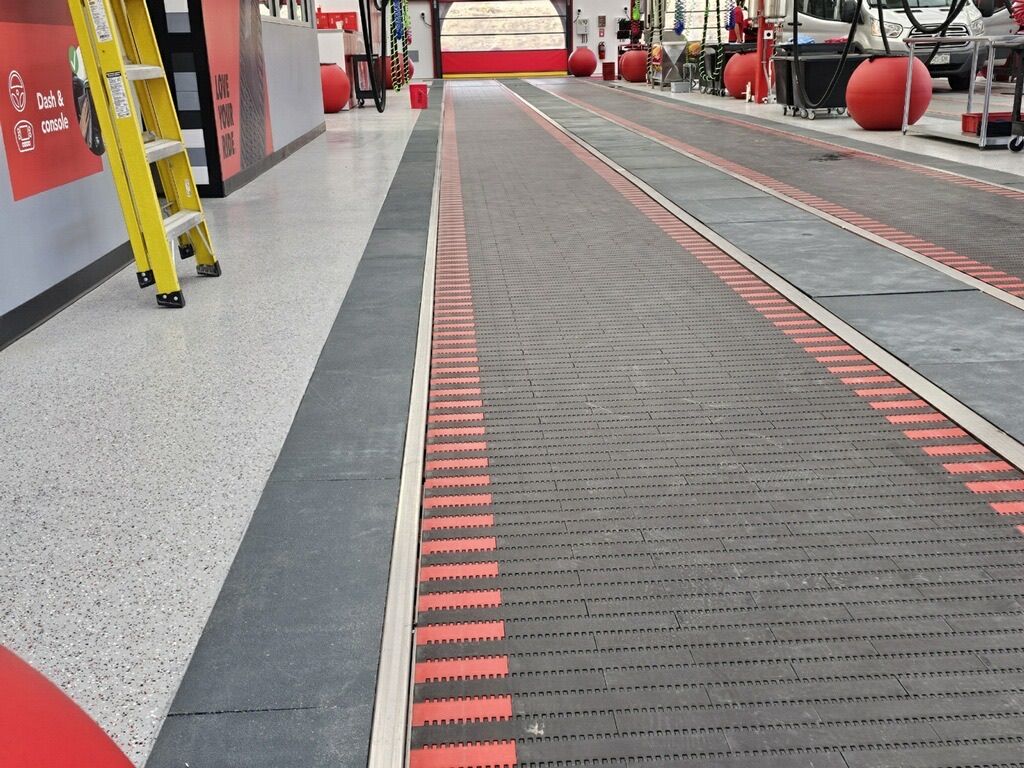 A yellow ladder sits on the side of a road