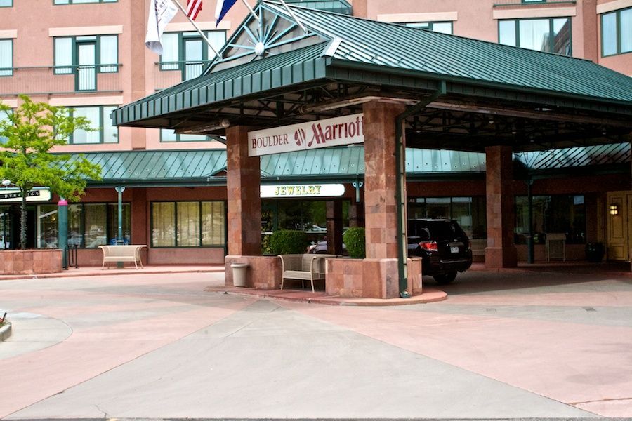 A car is parked in front of a marriott hotel