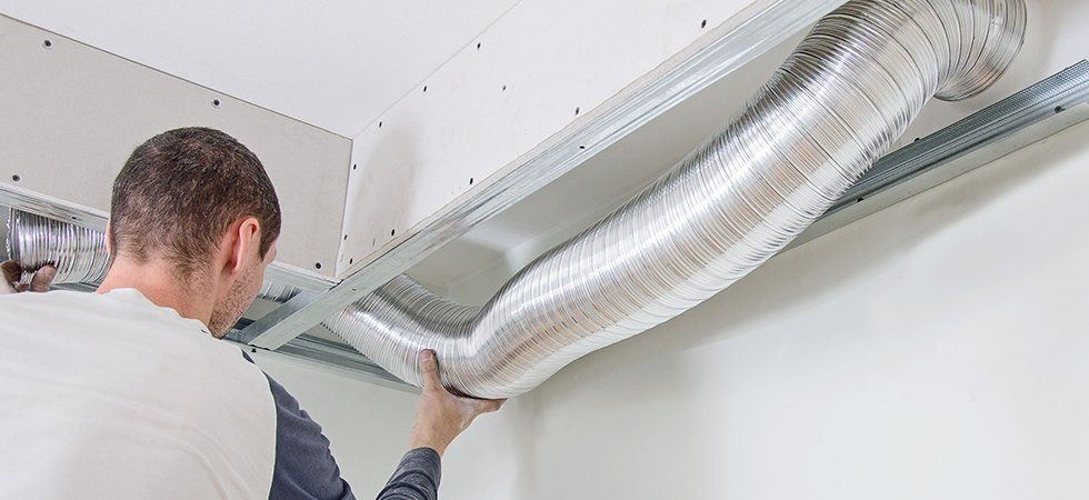 man fixing HVAC System
