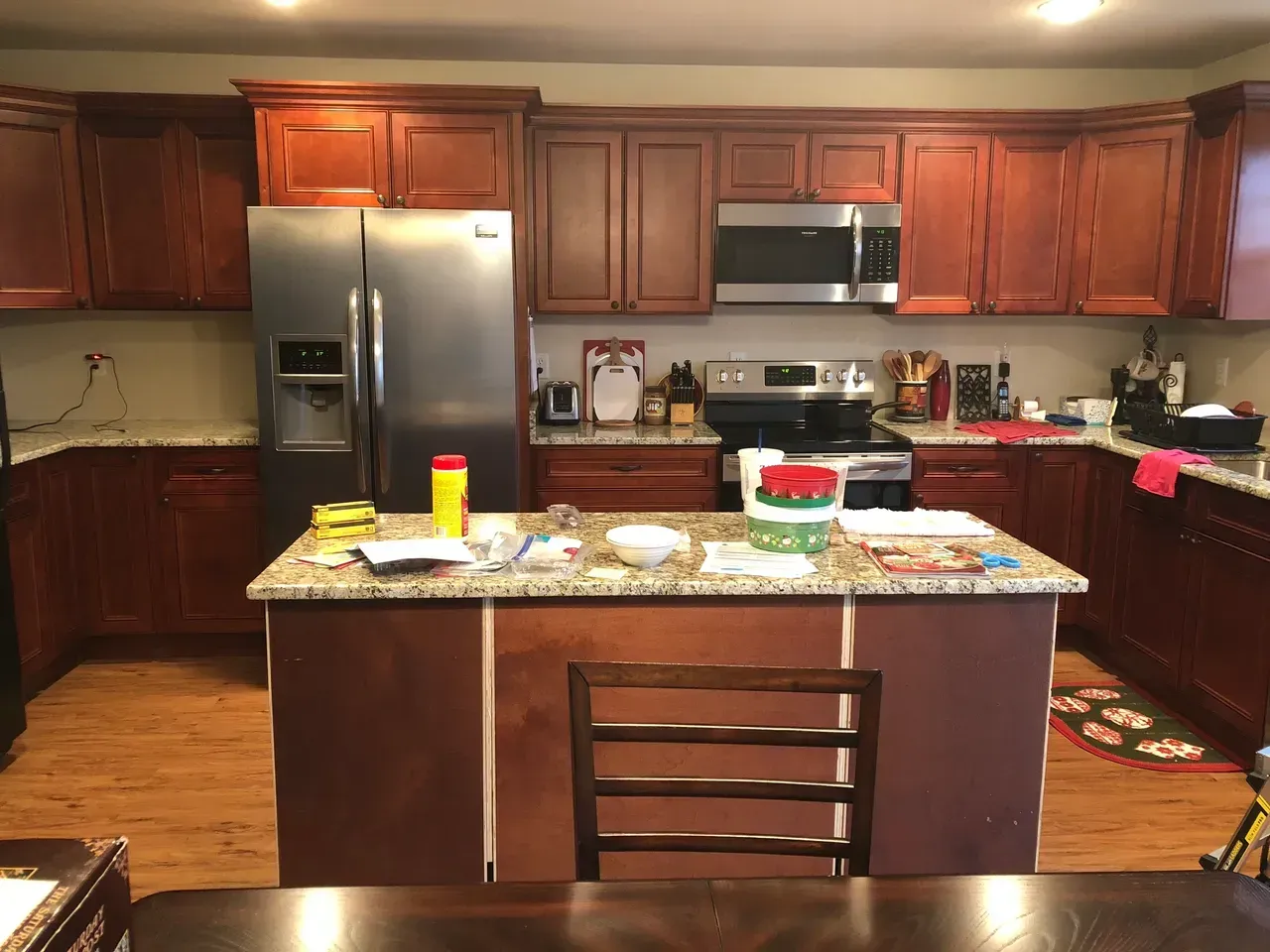 A kitchen with stainless steel appliances and wooden cabinets