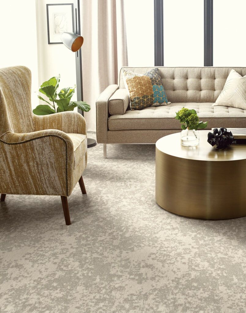 A living room with a couch , chair , and coffee table.