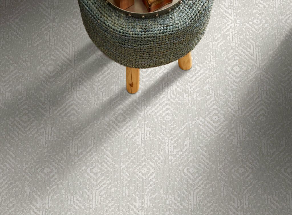 A stool is sitting on top of a white tiled floor.