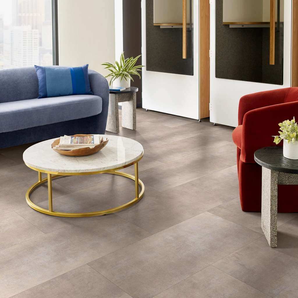 A living room with a couch , chair , and coffee table.