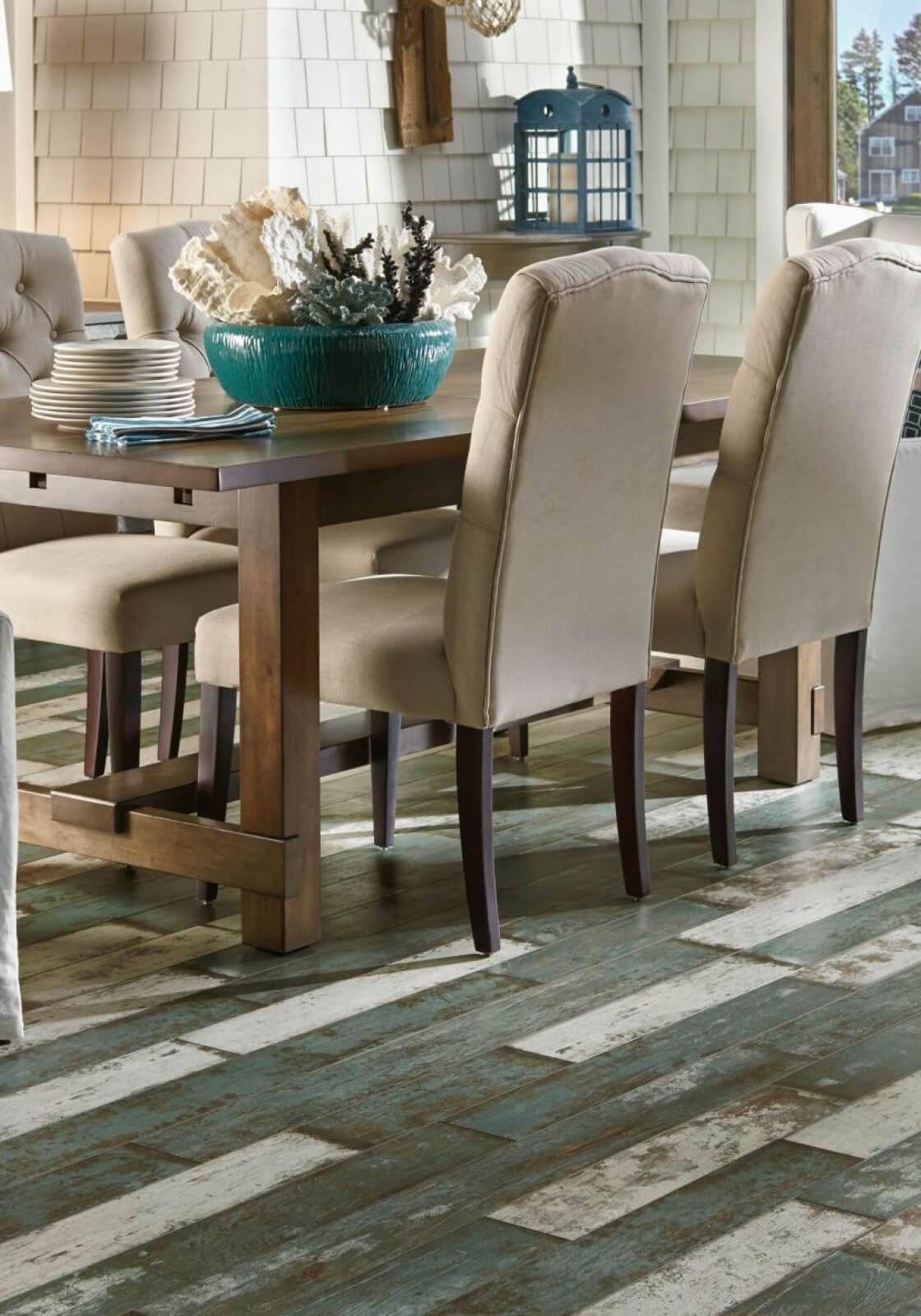 A dining room with a wooden table and chairs