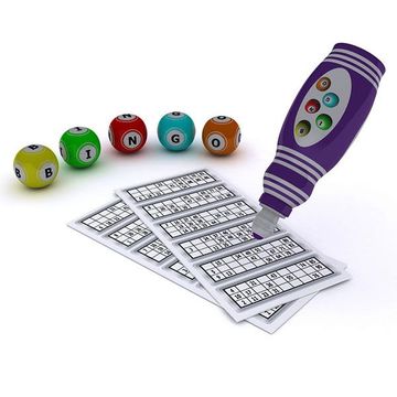 Bingo balls, cards, and a purple bingo marker on a white surface.