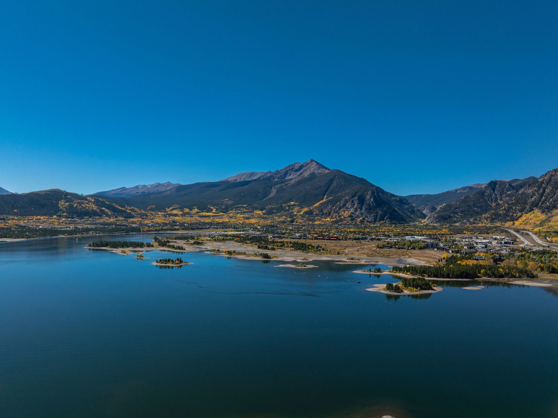 Doctor using a stethoscope on a young child's chest in a medical setting