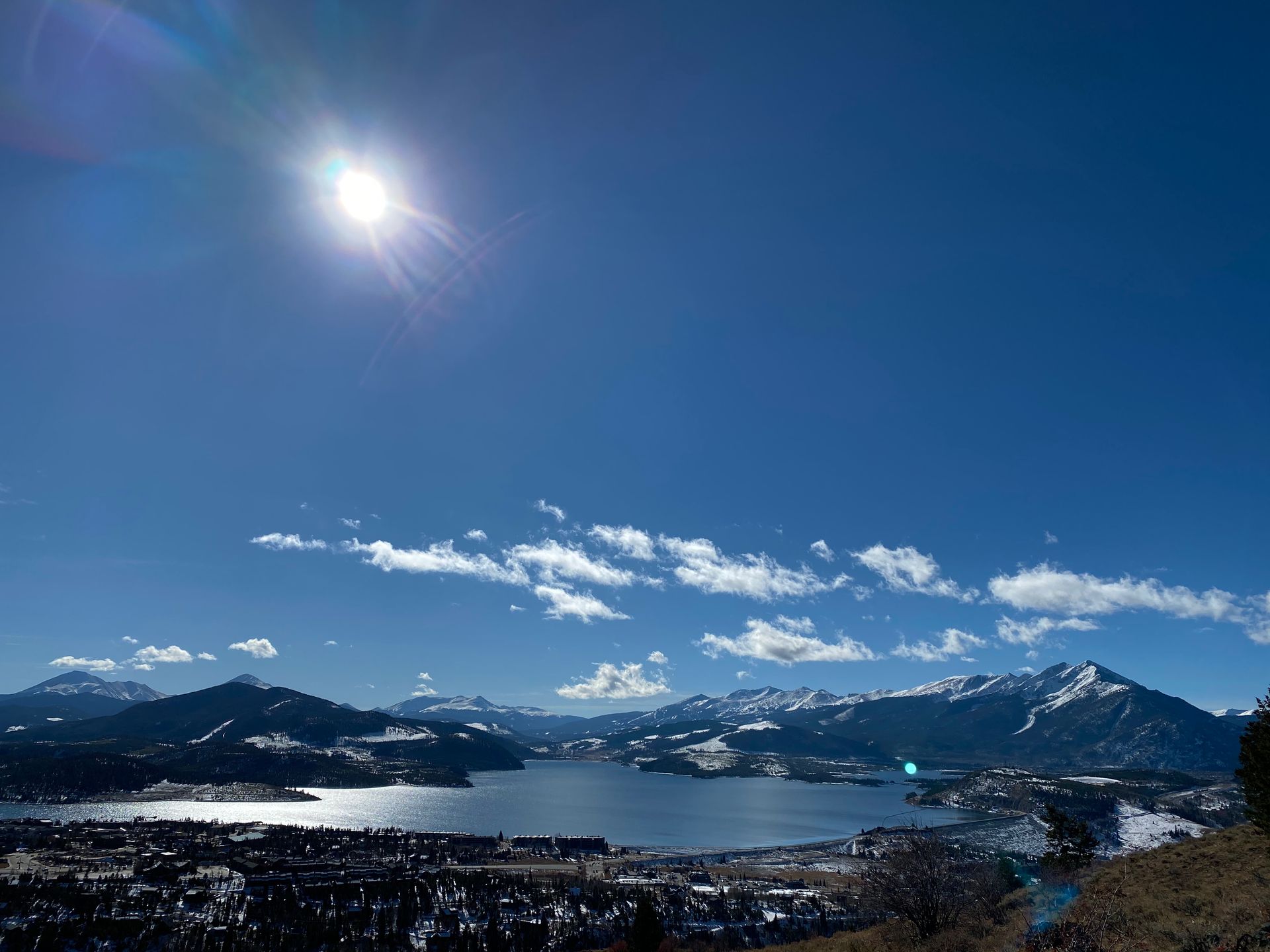Doctor in white coat speaking with patient in exam room