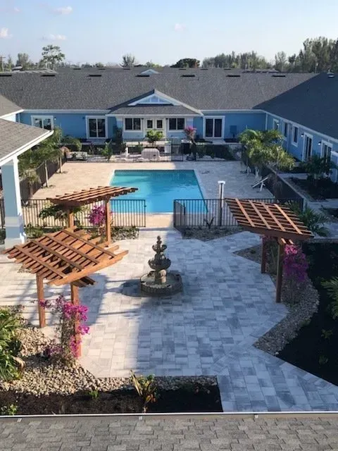 An aerial view of a house with a swimming pool