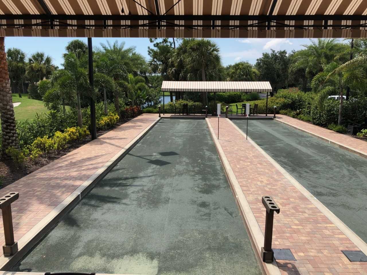 A bowling alley with a striped awning over it