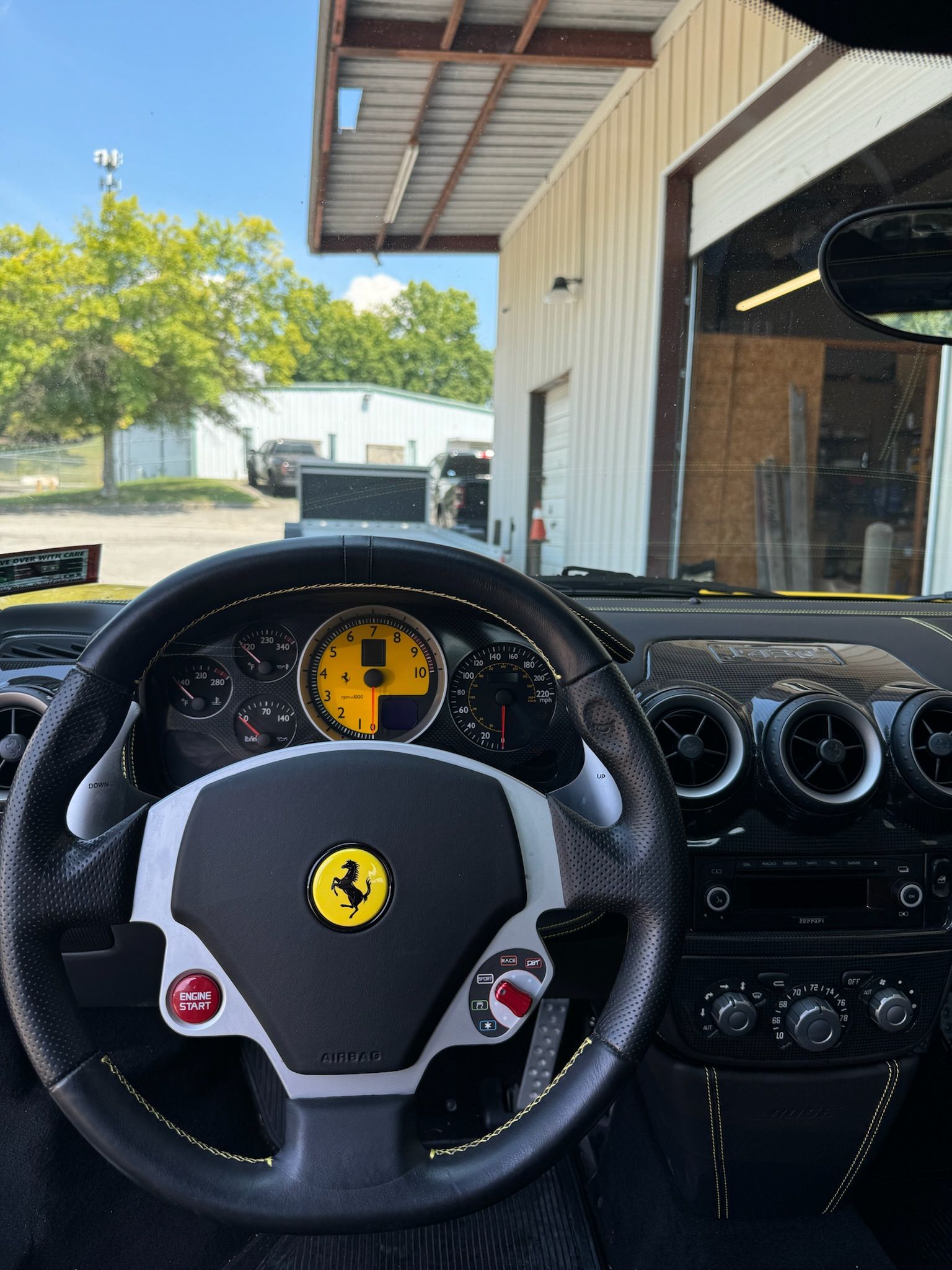 A steering wheel with a ferrari logo on it