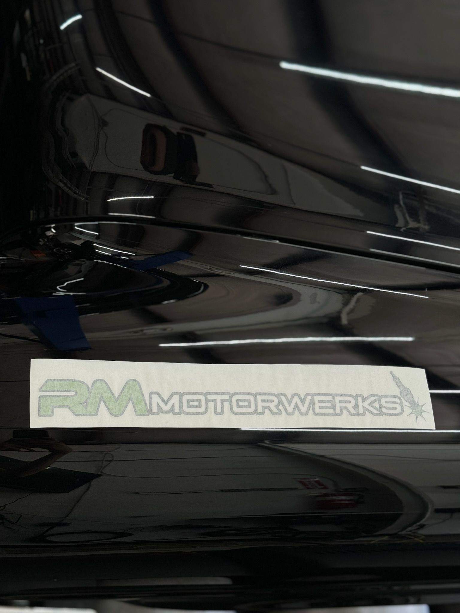 A sticker on the side of a car that says fm motorworks