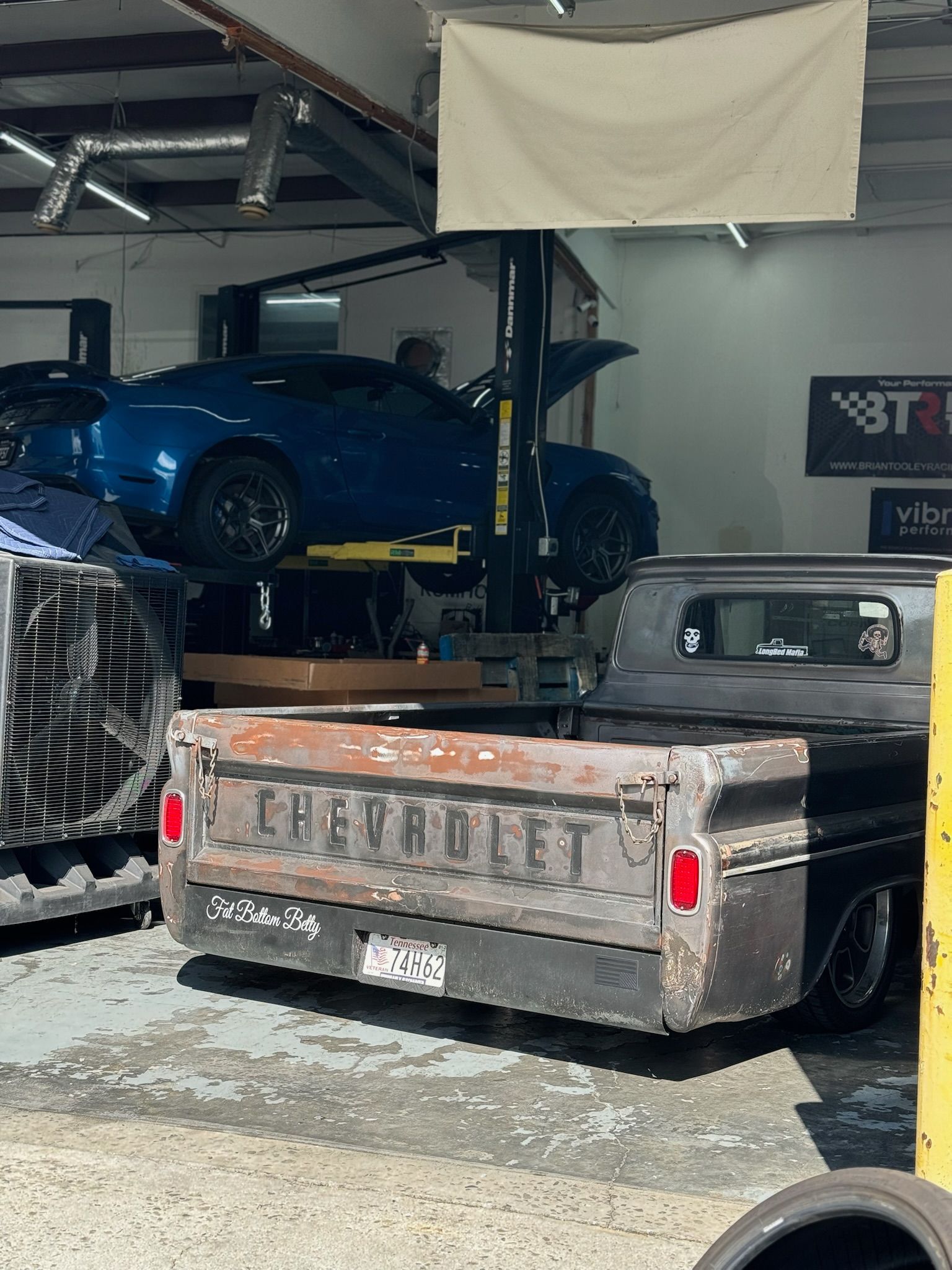 A chevrolet truck is parked in a garage