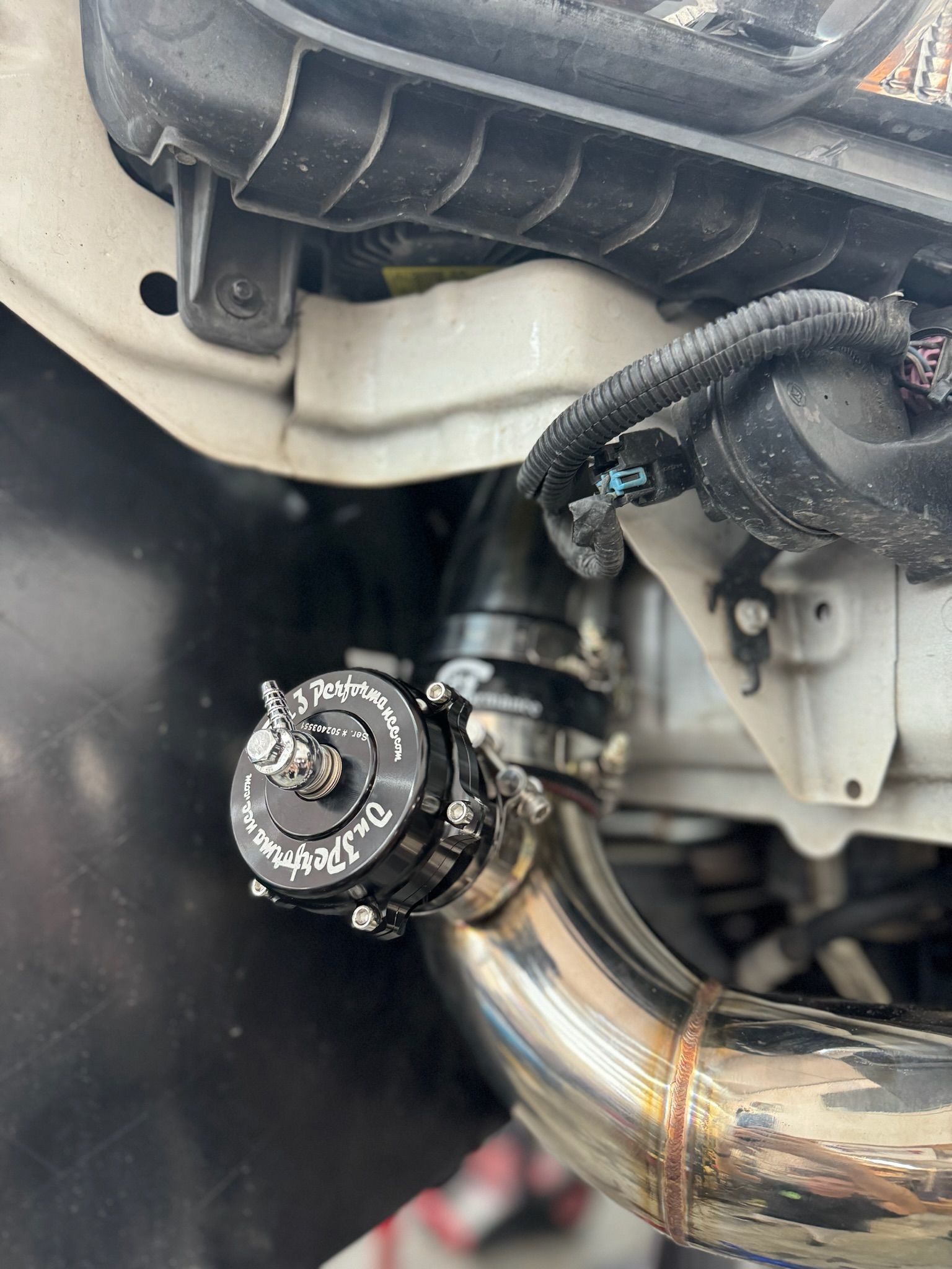 A close up of a valve on the side of a car.