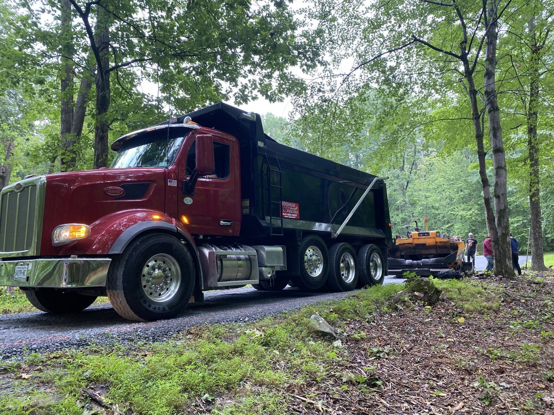 Joshua Paving Inc red and black truck