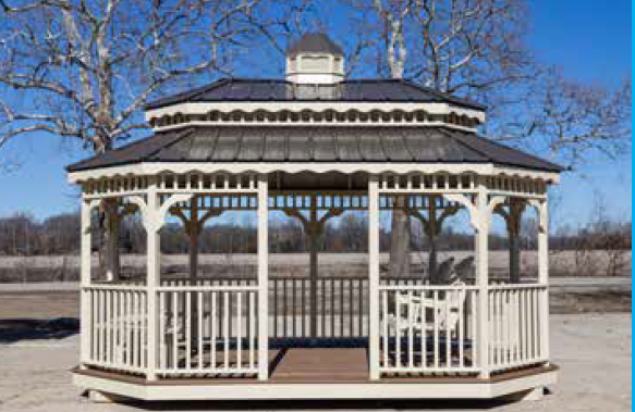 Octagonal white gazebo with a dark roof and deck, set outdoors on a sunny day.
