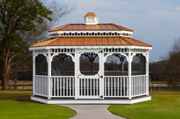 White gazebo with copper roof on a grassy lawn; pathway leading to the entrance.