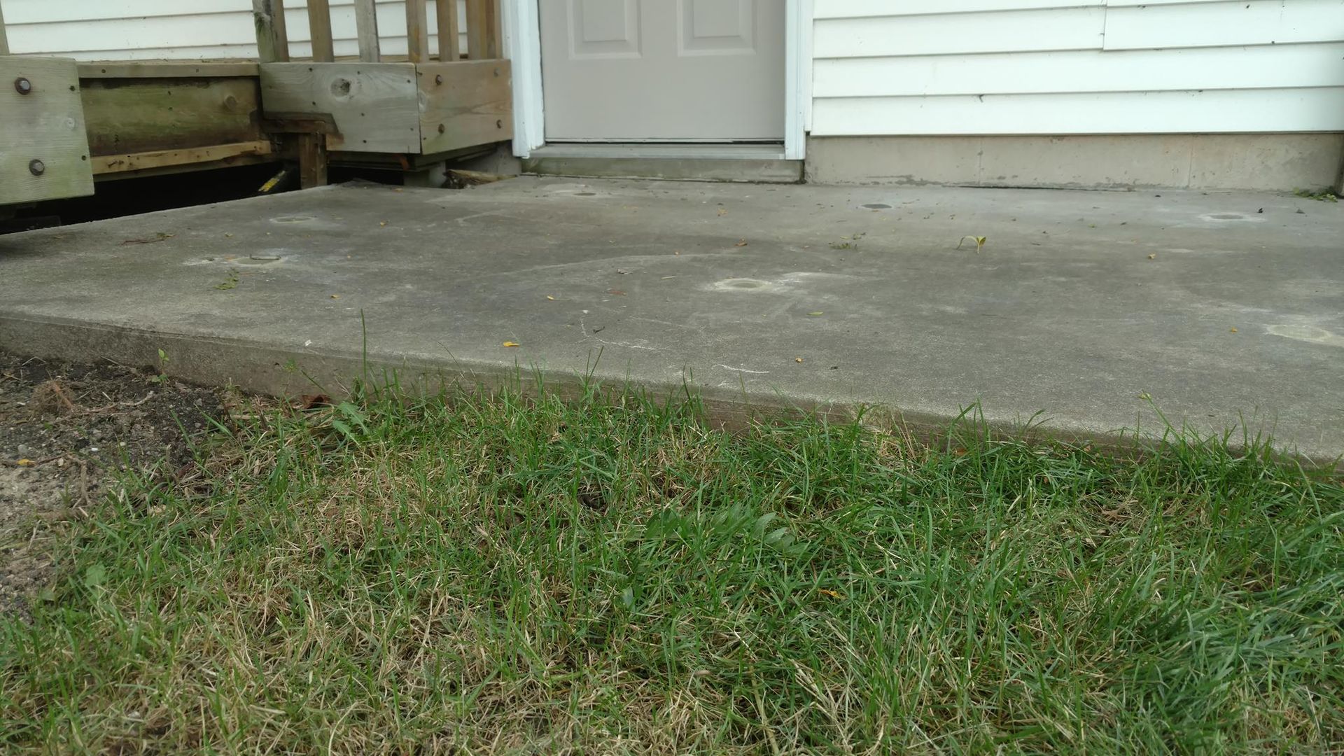 A concrete patio in front of a house - after