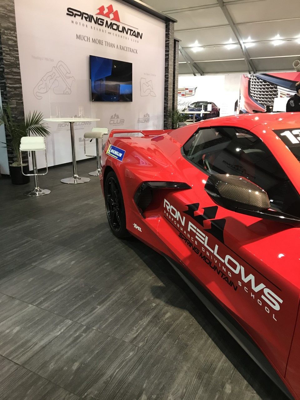 A red sports car with ron fellows written on the side