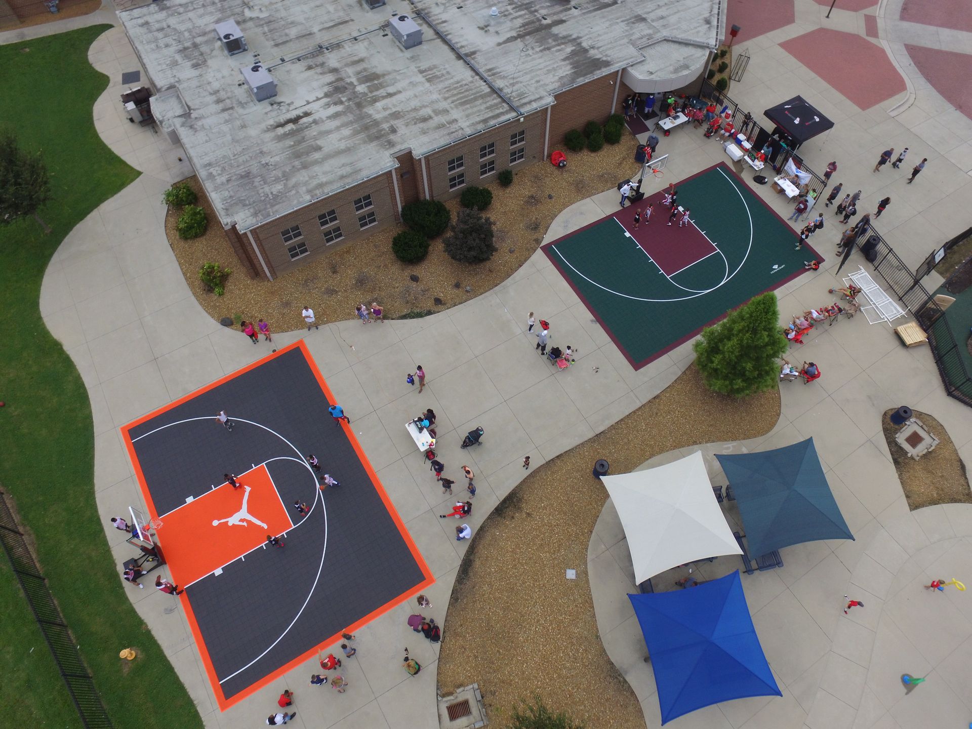 An aerial view of a basketball court with a jordan logo on it