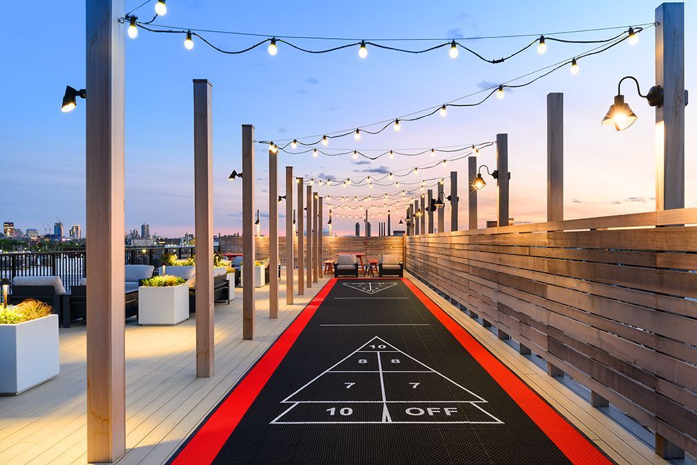 An artist 's impression of a shuffleboard court on a rooftop deck