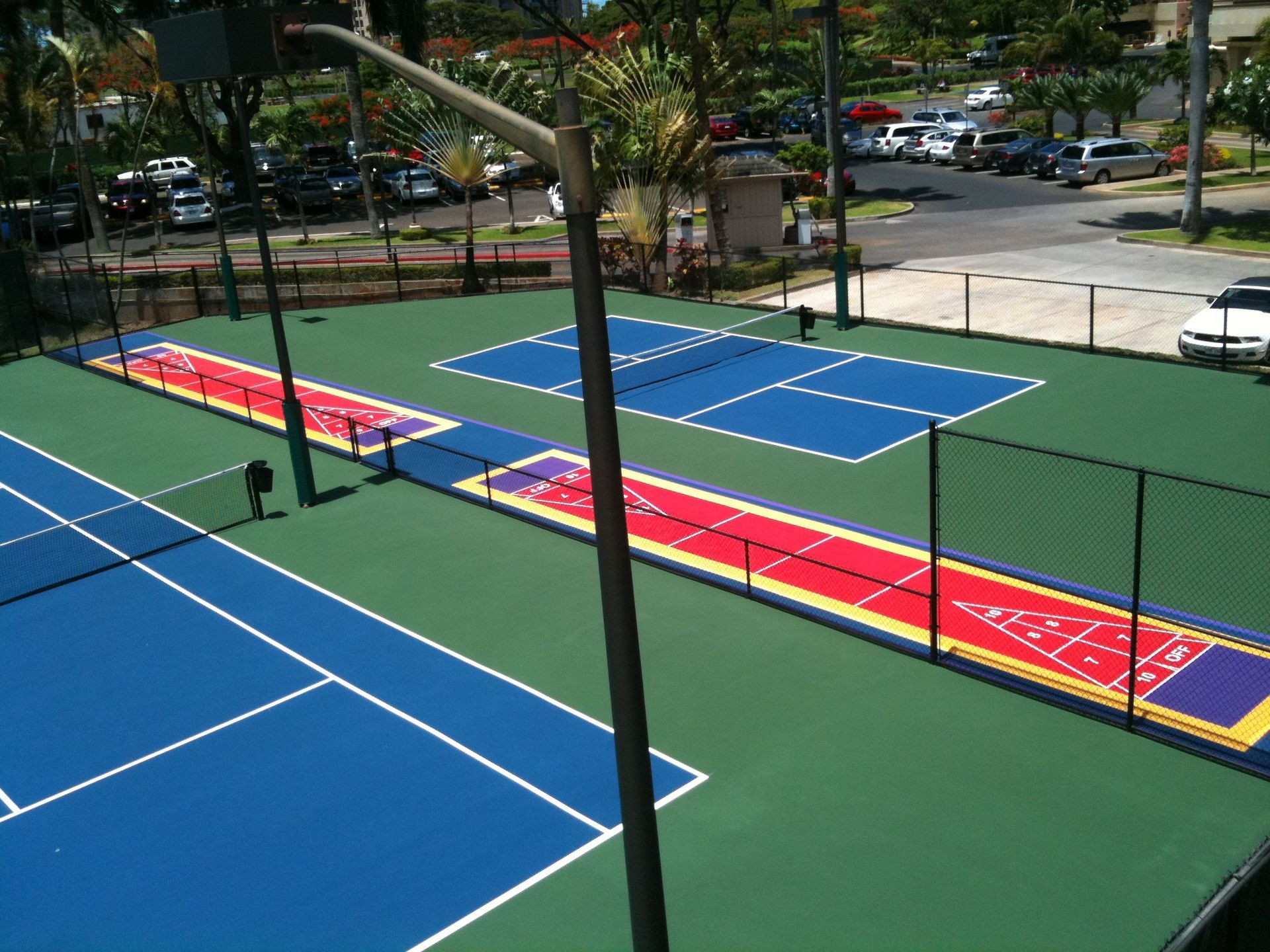 An aerial view of a tennis court with the letters ucsd painted on it