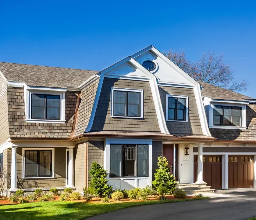 A large house with a blue sky in the background.