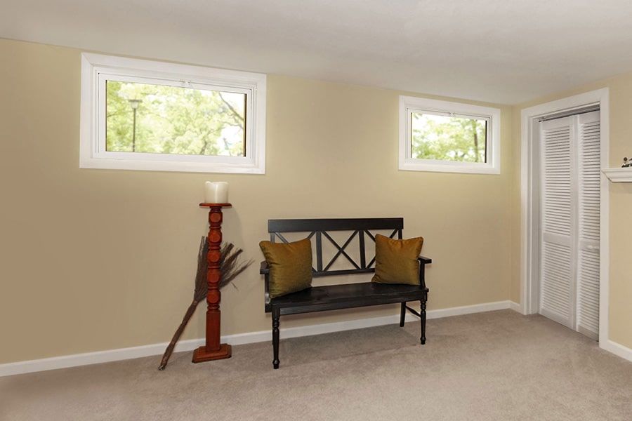A room with a bench and a candle holder