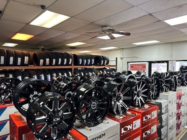 A store filled with lots of tires and wheels